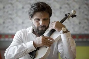 بیژن مرتضوی در کنار تام کروز در حاشیه بازی فینال جام جهانی ۲۰۲۶/ عکس